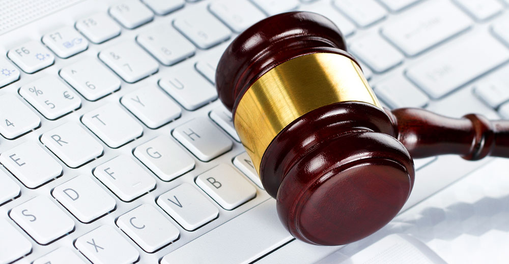 judge's gavel on a computer keyboard