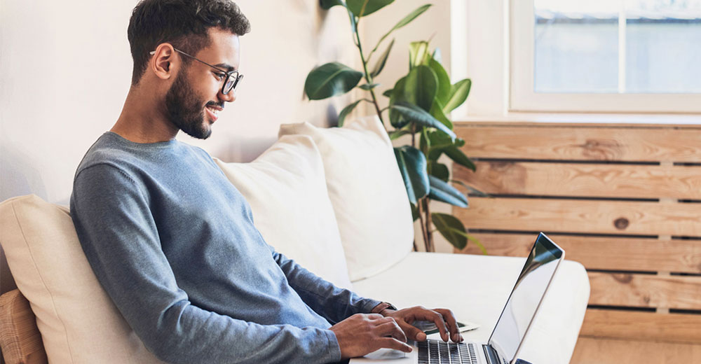 young man using a laptop computer